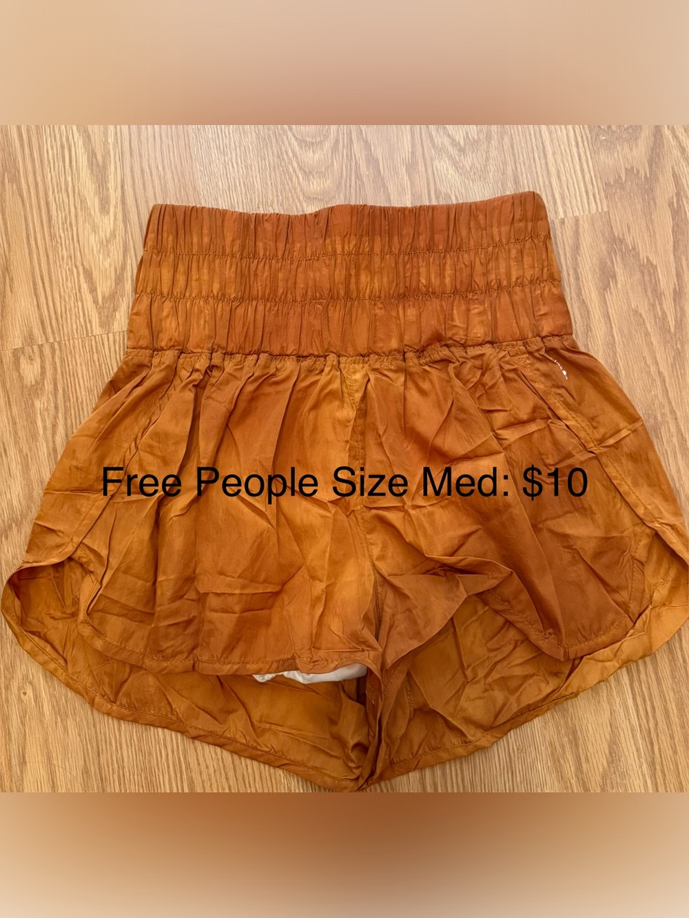 Free People High-Waist Smocked Shorts in Rust